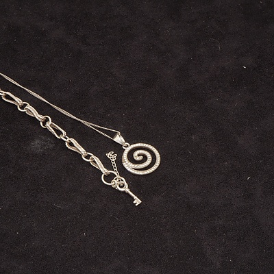 Sterling Silver and CZ Swirl Pendant and a Sterling Silver Bracelet