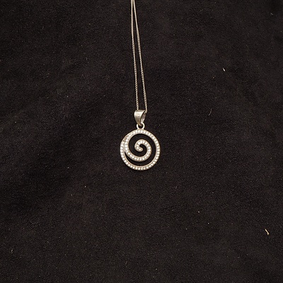 Sterling Silver and CZ Swirl Pendant and a Sterling Silver Bracelet