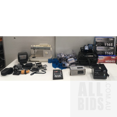 Assortment Of Digital And Still Cameras, Retro Mini TV, Toner Cartridges, Sewing Machine, Step Down Transformer And Other Items