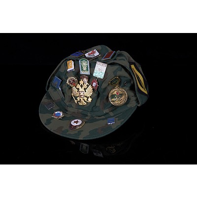 Russian Military Cap with Assorted Metal and Cloth Badges