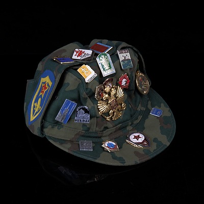 Russian Military Cap with Assorted Metal and Cloth Badges