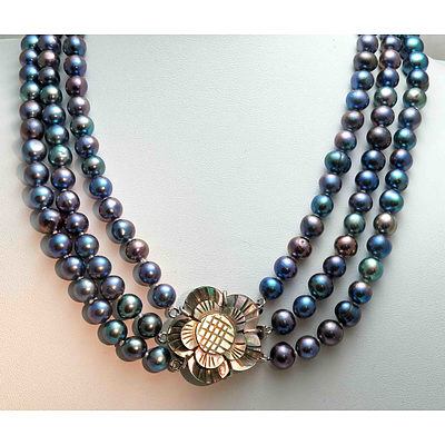 Triple Strand Necklace Of Peacock-Black Pearls With Carved Shell Clasp