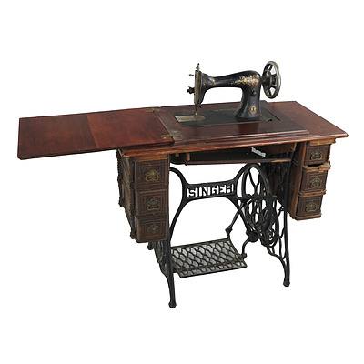 Antique Singer Treadle Sewing Machine With Cast Iron Base and Six Drawer Cabinet