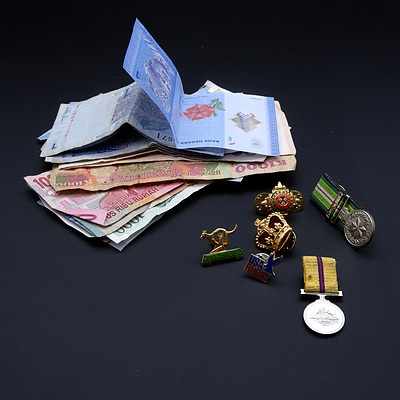 Collection of International Banknotes, Military Pins and Miniature Medals, Including Malaysia, Zambia, Singapore and More
