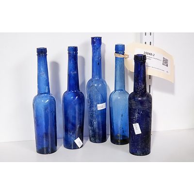 Five Antique Cobalt Blue Glass Bottles
