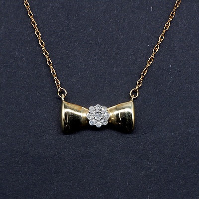 10ct Yellow Gold and Diamond Pendant on a 14ct Gold Plated Chain