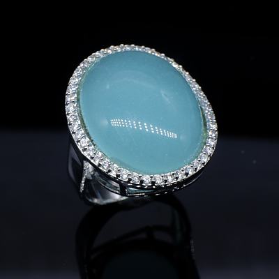 Sterling Silver Ring with Large Cabochon of Blue Paste Surrounded by CZ