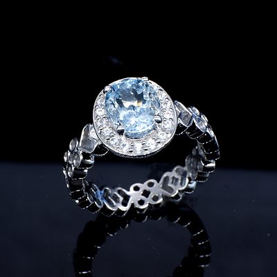 Sterling Silver Ring with Pale Blue Topaz and CZ