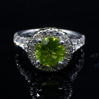 Sterling Silver Ring with Round Peridot Surrounded by White and Green CZ