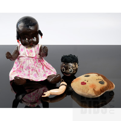 Antique Composite Black Doll with Movable Limbs and Cotton Clothin, and Three Early Doll Body Parts