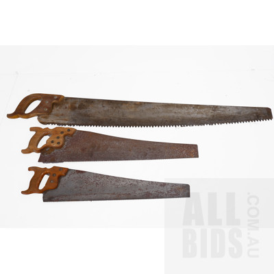 Vintage Single-End Log Saw and Two Vintage Hand Saws