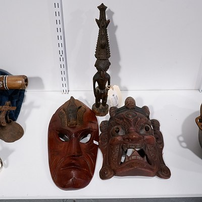 Two Eastern Carved Wooden Masks and a Carved Tribal Totem