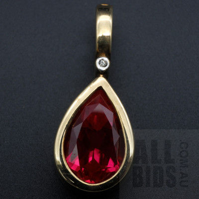 9ct Yellow Gold Pendant with Tear Drop Faceted Created Ruby and a RBC Diamond, 3.60g.