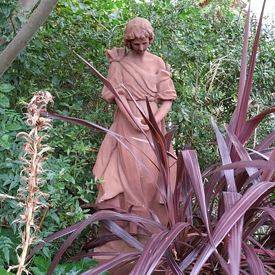 Terracotta Coloured Composite Figure of Gabriel, on a Pedestal