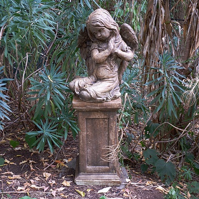 Cast Composite Figure of a Praying Angel on a Pedestal