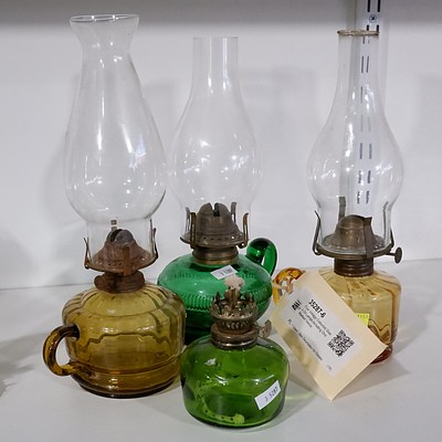 Four Vintage Coloured Glass Oil Lamps including One Marked Venus