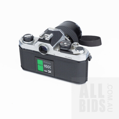 Vintage Nikon 35mm SLR Film Camera with Nikkor 105mm 1:25 Lens, Nikkor 35mm 1:2 Lens, Three Filters, Monopod, and Soft Carry Case