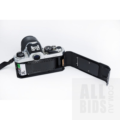 Vintage Nikon 35mm SLR Film Camera with Nikkor 105mm 1:25 Lens, Nikkor 35mm 1:2 Lens, Three Filters, Monopod, and Soft Carry Case