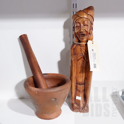 Large Clay Mortar with Wooden Pestle and a Carved Wooden Figurine