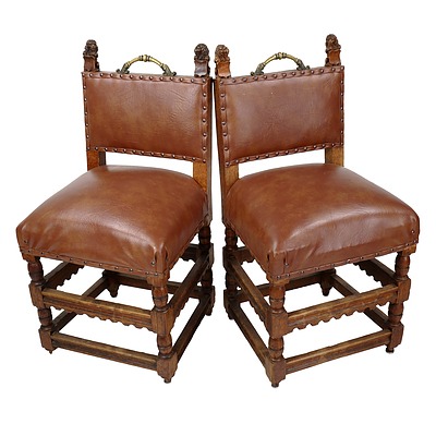 Pair of Antique Oak Neo-Gothic Sidechairs with Decorative Lion Corbells and Brass Handles