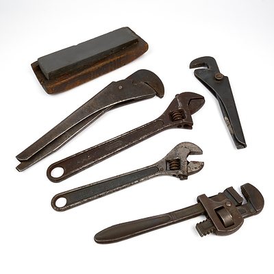 Five Antique and Vintage Wrenches and Spanners and a Sharpening Stone ()