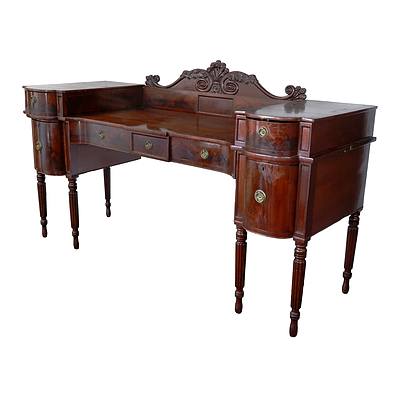 Regency Serpentine Front Flame Mahogany Sideboard with Six Fluted Legs and Carved Scroll and Prince of Wales Feather Crest, Circa 1825