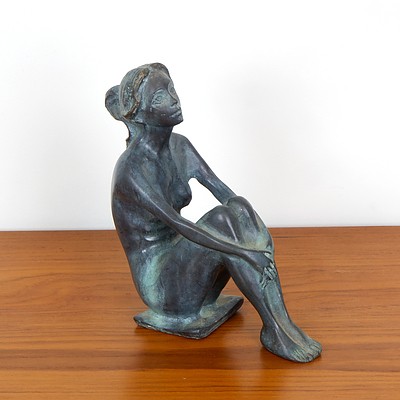 Patinated Cast Metal Figure of a Seated Nude
