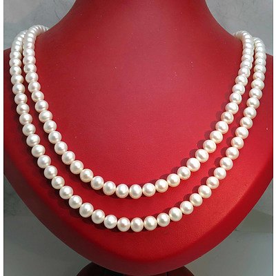 Double Strand of very long Cultured Pearls, strung to SILVER Clasp
