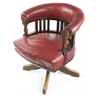 Antique Oak Swivel Captains Chair With Burgundy Leather Upholstery