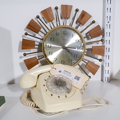 Vintage Cream Rotary Dial Telephone and a Retro Paico Sunburst Style Wall clock