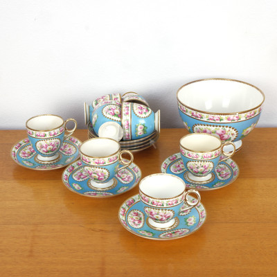 Eight Antique Hand Painted Tea Pairs with Gilt Highlights and Floral Medallions