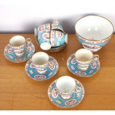 Eight Antique Hand Painted Tea Pairs with Gilt Highlights and Floral Medallions