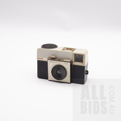 Vintage Kodak Instamatic 25 Camera, Brownie Camera, Two Slide Viewers, Leather Camera Case, Sports Binoculars, and a Flash Unit