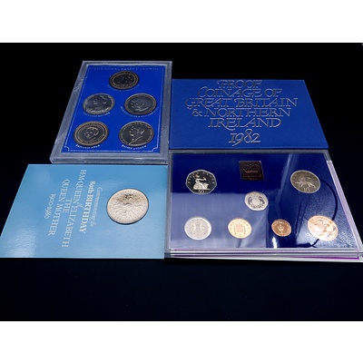 Cased Royal Family Crowns, 80th Birthday of The Queen Mother Crown, and 1982 Royal Mint Proof Set