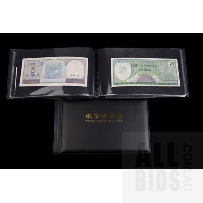 Two Banknote Books with International Banknotes From: Brazil, Indonesia, Singapore, Fiji and More