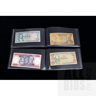 Two Banknote Books with International Banknotes From: Brazil, Indonesia, Singapore, Fiji and More