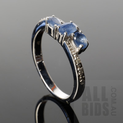 Sterling Silver Ring with Three Pale Blue Celanese Type Sapphires and Single Cut Diamonds, 