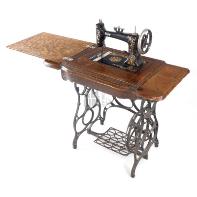 Antique Treadle Sewing Machine with Cast Iron Base and Oak Cabinet