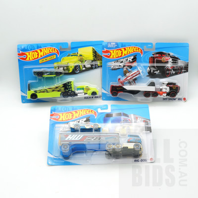 Three Boxed Hot Wheels Super Rigs, Including Rock N Race, Rig Dogs and Sky Show Rig