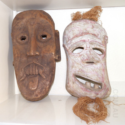 Two Carved Wooden Tribal Masks Including Sarawak Ghost Mask