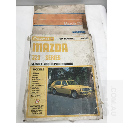 Assorted Books And A Marvel Comic, Including Mazda 323 Series And Mazda Capella And 616 Car Manuals