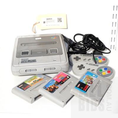 Nintendo Super Nintendo Entertainment System, with Two Controllers and Three Games