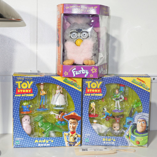 Two Boxed Toy Story Figures and a Boxed Furby Toy