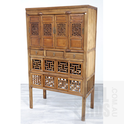 Chinese Cypress Cabinet with Carved and Pierced Upper Door Panels and Latticework Lower Panels