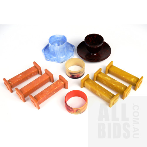 Collection of Bakelite and Early Plastic Knife Rests, Napkin Rings and Egg Cups