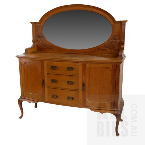 1920's Oak Bowfront Sideboard with Oval Bevelled Mirror Back and Original Brass Handles