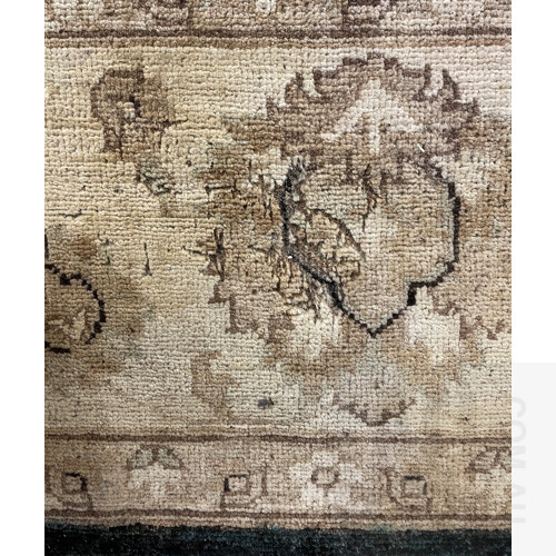 Large Woollen Carpet. Overall floral arabesque design, in tones of cream & cobalt. Some insect damage and light water staining, (305x245cm)