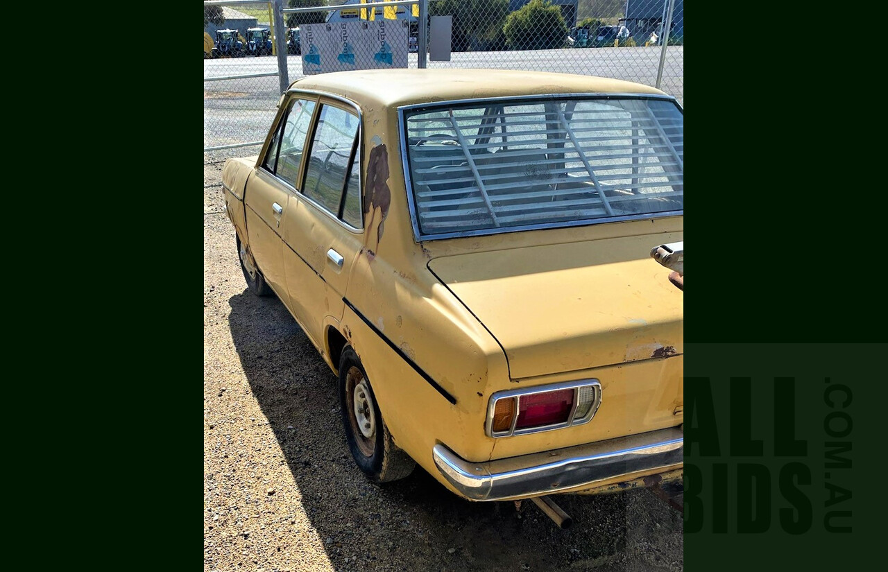 8/1973 Datsun 1200 Deluxe Sedan Yellow 1.2L