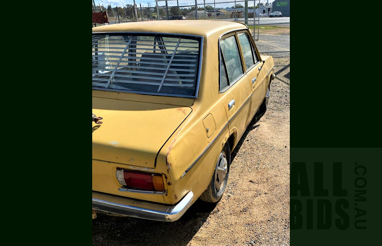 8/1973 Datsun 1200 Deluxe Sedan Yellow 1.2L