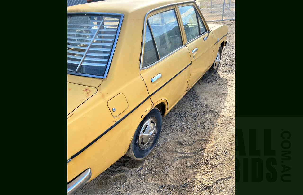 8/1973 Datsun 1200 Deluxe Sedan Yellow 1.2L